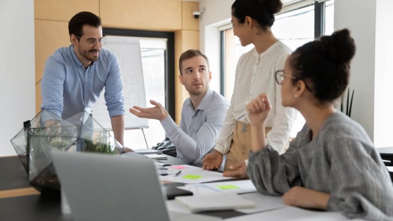 Colleagues Talking To Each Other