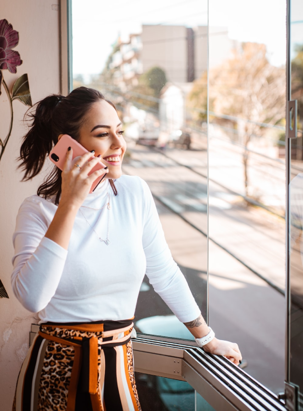 girl standing uses a phone