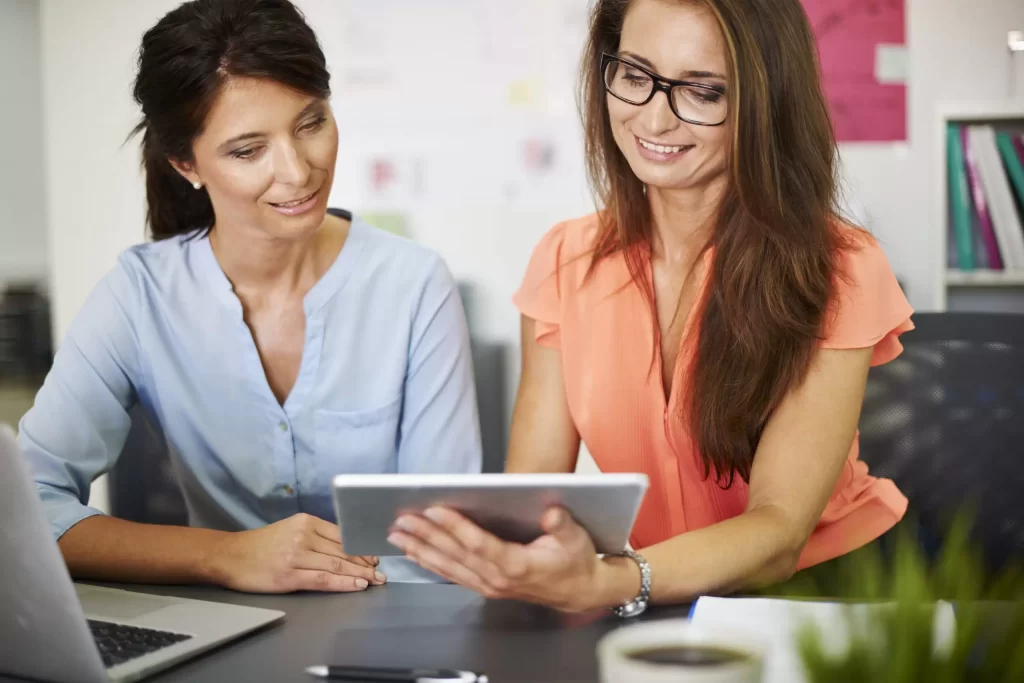 Two girls using Laptop