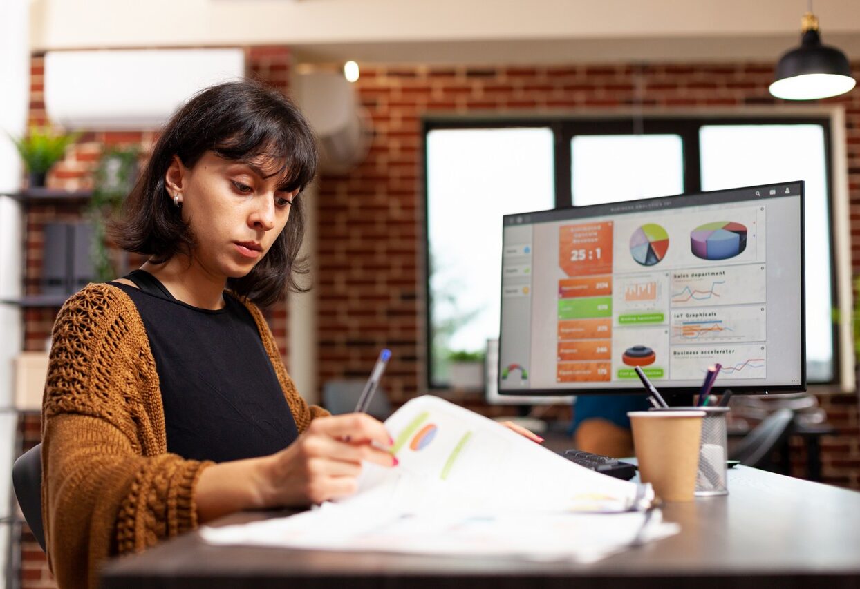 Businesswoman analyzing marketing graph